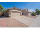 A single-story home with desert landscaping and a two car garage at 1110 W Seagull Dr, Chandler, AZ 85286