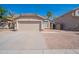 A single-story home with desert landscaping and a two car garage at 1110 W Seagull Dr, Chandler, AZ 85286
