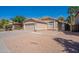 Charming single-story home with a two car garage and desert landscaping at 1110 W Seagull Dr, Chandler, AZ 85286