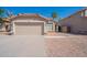 Charming single-story home with a two car garage and desert landscaping at 1110 W Seagull Dr, Chandler, AZ 85286