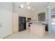 Modern kitchen with light-colored cabinets, island, and stainless steel appliances at 1110 W Seagull Dr, Chandler, AZ 85286
