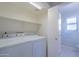 This is a laundry room with modern washer and dryer at 1110 W Seagull Dr, Chandler, AZ 85286
