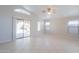 Spacious living room featuring tile floors, abundant natural light, and access to the backyard at 1110 W Seagull Dr, Chandler, AZ 85286