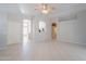 An open living space with tile floors and an open view of the kitchen at 1110 W Seagull Dr, Chandler, AZ 85286