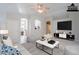 Bright living room with tile flooring, ceiling fan, and open concept design at 1110 W Seagull Dr, Chandler, AZ 85286