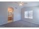 The main bedroom includes a ceiling fan and view to bathroom, adding convenience and comfort at 1110 W Seagull Dr, Chandler, AZ 85286