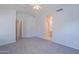 Large bedroom with ceiling fan, walk-in closet, and views of the bathroom at 1110 W Seagull Dr, Chandler, AZ 85286
