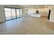 Open-concept living area featuring new tile flooring and ample light at 11818 N Vanero Ct, Maricopa, AZ 85139
