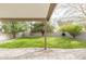 Spacious backyard featuring a large grassy area and covered patio at 1249 W Seascape Dr, Gilbert, AZ 85233