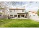 A large backyard with a lawn, patio, and spa at 1249 W Seascape Dr, Gilbert, AZ 85233