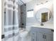 Modern bathroom featuring walk-in shower, tiled floors, and vanity with sink at 1249 W Seascape Dr, Gilbert, AZ 85233