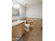 Neutral-toned half bathroom featuring tiled floors and decorative mirror at 1249 W Seascape Dr, Gilbert, AZ 85233