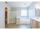 This bright bathroom features a separate shower and tub at 1249 W Seascape Dr, Gilbert, AZ 85233