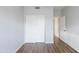Bright bedroom features wood floors and a closet with sliding doors at 1249 W Seascape Dr, Gilbert, AZ 85233