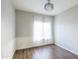 Bedroom with wood floors, wainscoting and white sheer curtains at 1249 W Seascape Dr, Gilbert, AZ 85233