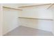 A spacious closet with wood racks and neutral carpet at 1249 W Seascape Dr, Gilbert, AZ 85233