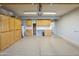Spacious garage with epoxy floors, ample storage cabinets, and utility sink at 1249 W Seascape Dr, Gilbert, AZ 85233