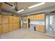Large garage with storage cabinets and sink at 1249 W Seascape Dr, Gilbert, AZ 85233