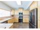 Kitchen features stainless steel appliances, wood cabinets, and tile countertops at 1249 W Seascape Dr, Gilbert, AZ 85233