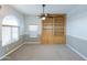 This living room features a large arched window, wainscotting, and a built-in bookcase at 1249 W Seascape Dr, Gilbert, AZ 85233