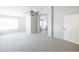 Spacious main bedroom with ceiling fan, neutral carpet, and ensuite bathroom at 1249 W Seascape Dr, Gilbert, AZ 85233