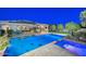 Aerial view showcases a beautiful backyard oasis with a pool, spa, outdoor kitchen, and lounge area at 12859 W Calle De Baca --, Peoria, AZ 85383