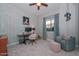 Bedroom designed as a home office featuring a desk, comfortable chair, accent seating, and ample natural light at 12859 W Calle De Baca --, Peoria, AZ 85383
