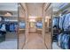 Walk-in closet leading to main bathroom featuring double vanity, soaking tub and plenty of storage at 12859 W Calle De Baca --, Peoria, AZ 85383