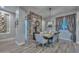 Chic dining area featuring a modern chandelier, stone accent wall, and stylish decor at 12859 W Calle De Baca --, Peoria, AZ 85383
