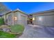 Exterior showcasing a two-car garage with a private entry gate and manicured landscaping at 12859 W Calle De Baca --, Peoria, AZ 85383