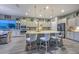 Gourmet kitchen with a large center island, granite countertops, stainless steel appliances, and pendant lighting at 12859 W Calle De Baca --, Peoria, AZ 85383