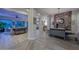 Open-concept living spaces with elegant flooring and a decorative stone wall in the dining area at 12859 W Calle De Baca --, Peoria, AZ 85383