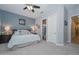 Spacious bedroom features a comfortable bed, stylish lighting, and ensuite bathroom access at 12859 W Calle De Baca --, Peoria, AZ 85383
