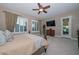 Relaxing bedroom suite offering ceiling fan, neutral carpet and adjacent entry to main bath and closet at 12859 W Calle De Baca --, Peoria, AZ 85383