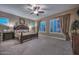 Elegant main bedroom featuring neutral tones, plush carpet, and plenty of natural light at 12859 W Calle De Baca --, Peoria, AZ 85383