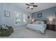 Tranquil bedroom features natural light, a comfortable bed, accent chair, and stylish decor at 12859 W Calle De Baca --, Peoria, AZ 85383