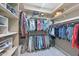Organized walk-in closet features double hanging rods, shelving, and ample storage space for clothes and accessories at 12859 W Calle De Baca --, Peoria, AZ 85383