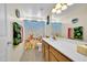 Bathroom with wooden cabinets, shower curtain with ocean theme and dinosaur towels at 1322 S 118Th Dr, Avondale, AZ 85323