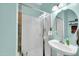Clean and tidy bathroom with a stand-up shower, white sink, and a mirror at 1322 S 118Th Dr, Avondale, AZ 85323