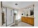 Bright bathroom featuring a walk-in shower and vanity at 1322 S 118Th Dr, Avondale, AZ 85323