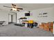 Versatile bonus room with gray carpet and entertainment options at 1322 S 118Th Dr, Avondale, AZ 85323