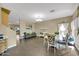 Bright dining area with tile flooring, modern lighting, and an open layout at 1322 S 118Th Dr, Avondale, AZ 85323