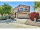 Charming two-story house featuring well-maintained landscaping, a two-car garage, and a neutral color at 1322 S 118Th Dr, Avondale, AZ 85323