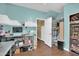 Bright blue room with stainless steel tables, white storage units and open door at 1322 S 118Th Dr, Avondale, AZ 85323