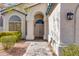 Inviting front entrance featuring double doors, an arched entryway, and manicured landscaping at 1331 E Voltaire Ave, Phoenix, AZ 85022
