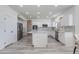 Spacious kitchen features white cabinets, an island with marble countertops, and stainless steel appliances at 1331 E Voltaire Ave, Phoenix, AZ 85022