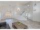 Bright, open living room with wood flooring, modern lighting, and stylish shutters at 1331 E Voltaire Ave, Phoenix, AZ 85022