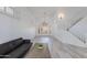 Bright, open living room with wood flooring, modern lighting, and stylish shutters at 1331 E Voltaire Ave, Phoenix, AZ 85022