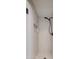 Modern shower with sleek fixtures, a built-in niche, and elegant tile at 1331 E Voltaire Ave, Phoenix, AZ 85022