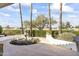 Beautiful courtyard featuring a decorative fountain, mature trees, and serene landscaping at 13514 W Wagon Wheel Dr, Sun City West, AZ 85375